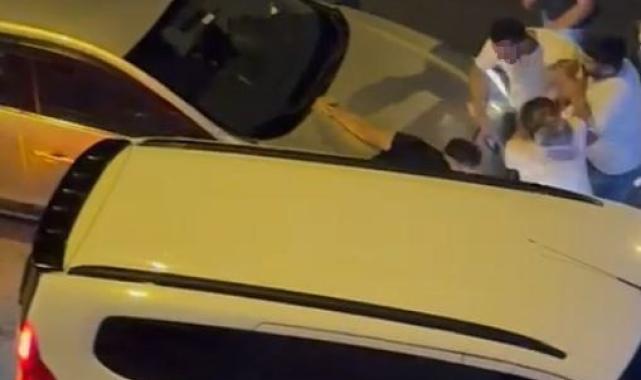 Trafikte tartıştığı sürücüyü iki aracın arasına sıkıştırıp darp etti