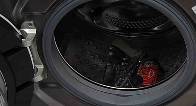 Evin her köşesinden senet, çamaşır makinesinden ise silah çıktı